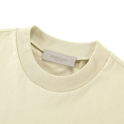 Light yellow T-shirt crewneck with small interior neck tag