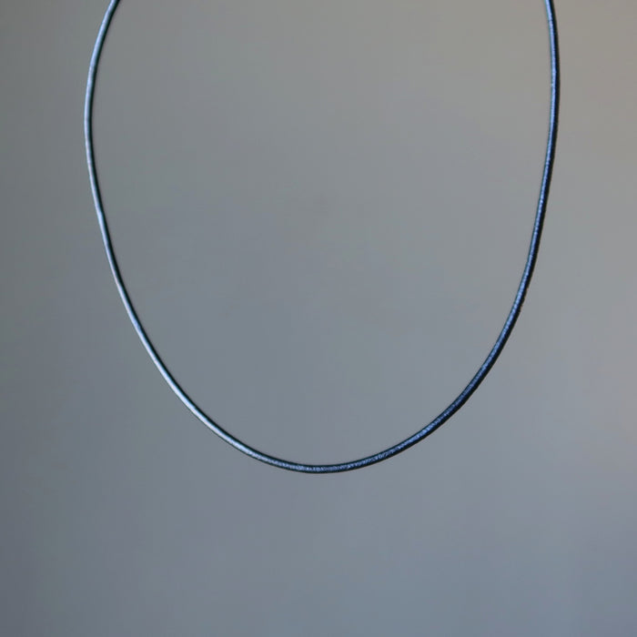 showing the lower portion of Faux Black Leather Cord