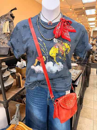 Denim blue western graphic T-shirt with bronco, firework clouds, and stars
