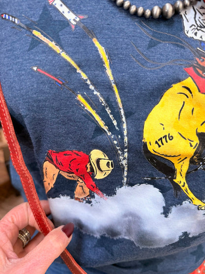 Denim blue graphic T-shirt with cowboy bronco and firework illustration