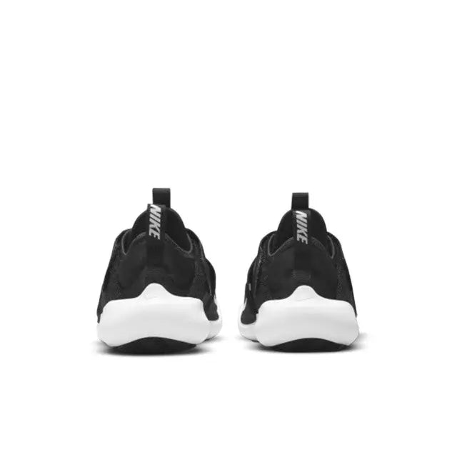 Black Nike Flex Advance sneakers, rear view with white heel and back pull tab
