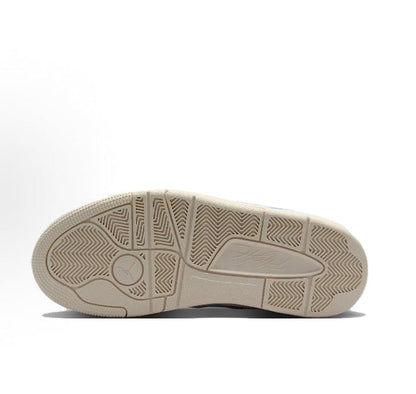 Low-top sneaker outsole with herringbone tread and circular traction pattern.