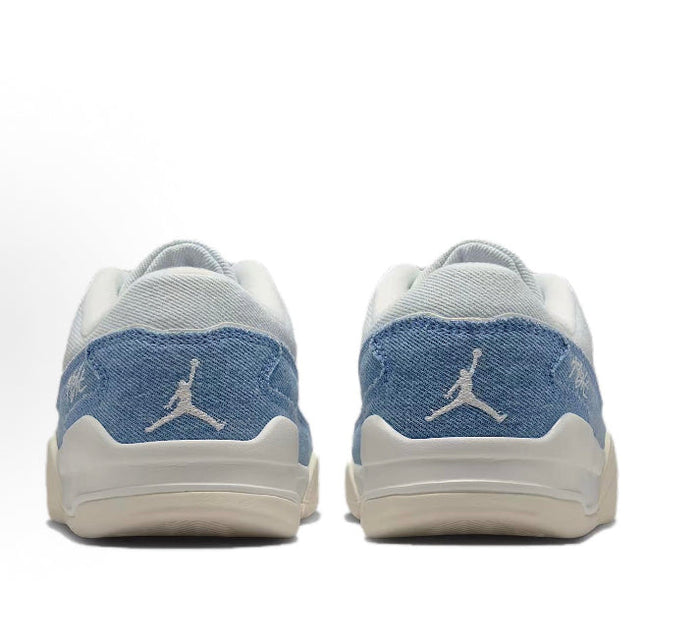 Pair of light blue and white sneakers with Jordan Jumpman logo on back heel.