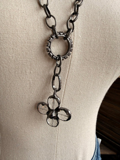 Floral crystal pendant necklace with flower-shaped charm and dangling chain links