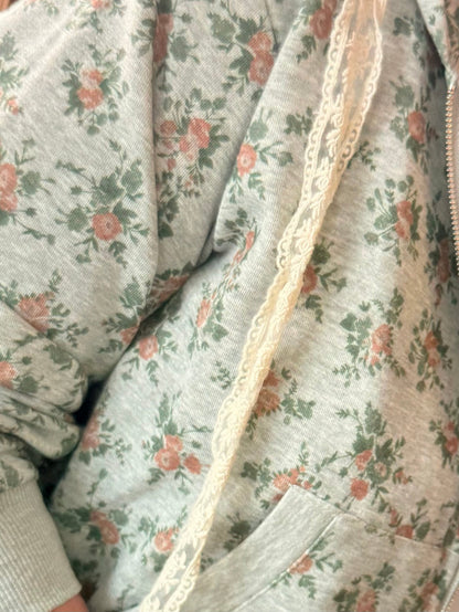 Mint floral hoodie fabric detail with cream lace trim along seam