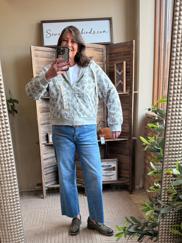 Floral zip-front hoodie in mint with cream trim, standing collar and long sleeves
