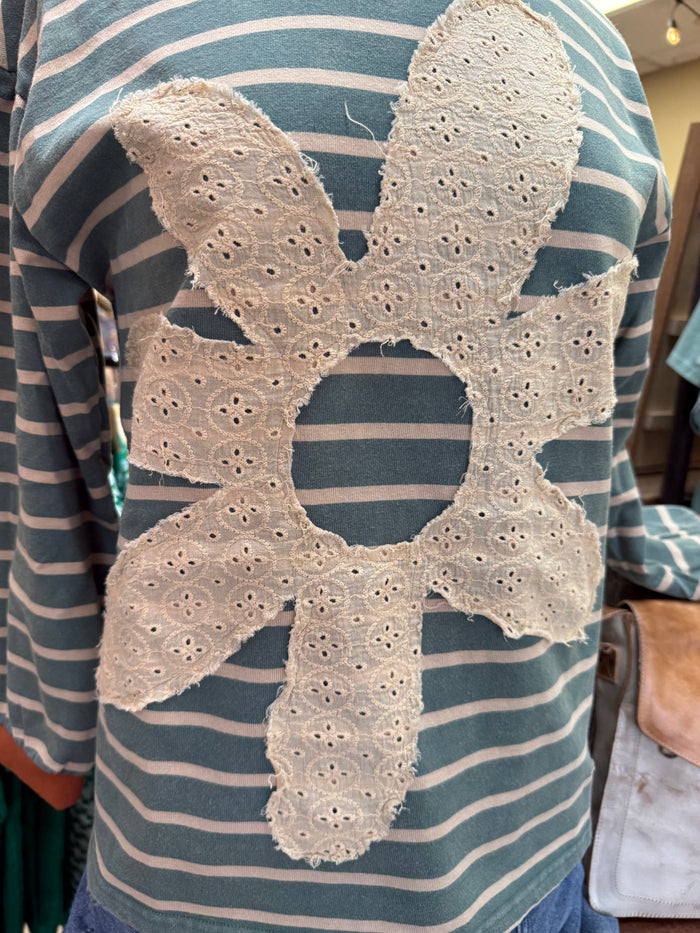 Striped sweatshirt with large white lace floral patch at front, long sleeves