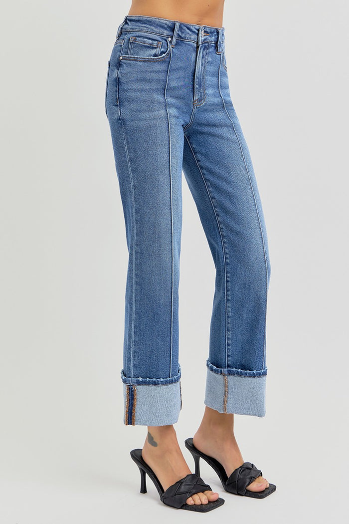Medium-wash front-seam jeans with cuffed hems and five-pocket styling.