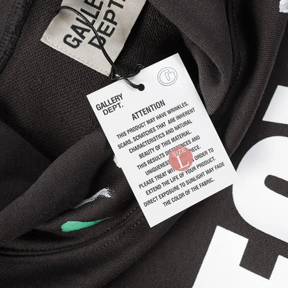 Black hoodie inside view with hanging size and care label at neckline