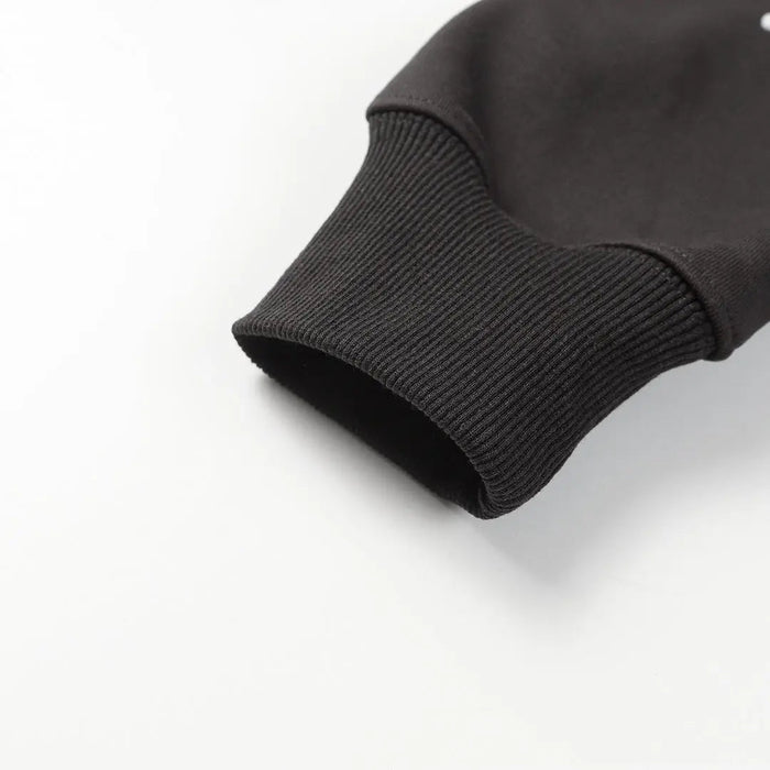 Black hoodie sleeve cuff with ribbed knit hem