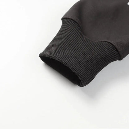 Black hoodie sleeve cuff with ribbed knit hem