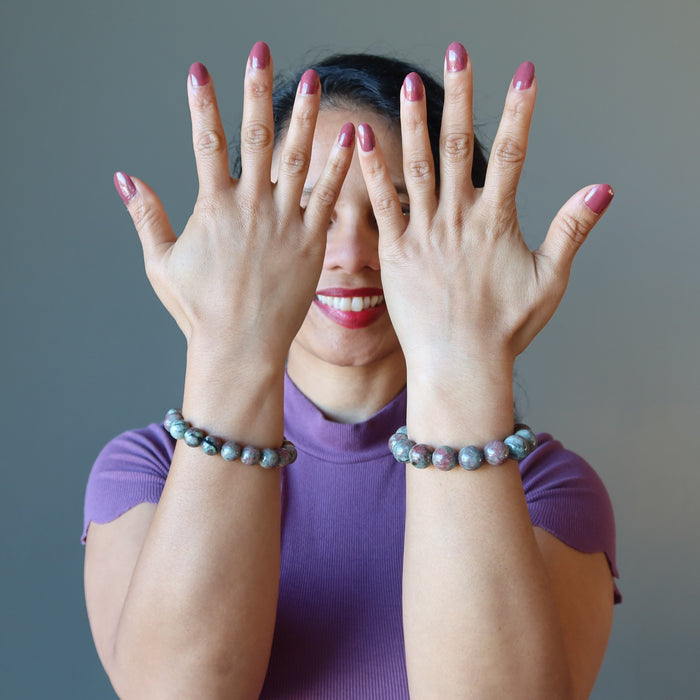 woman wearing two kashgar garnet bracelets