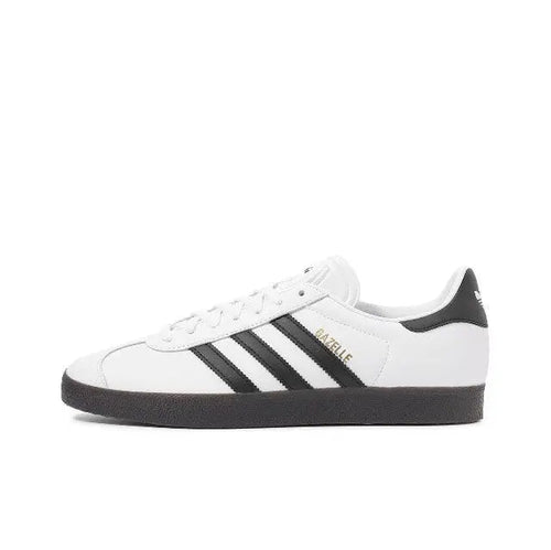 Adidas Gazelle Indoor sneakers in white with black stripes and black heel tab