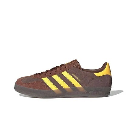 Adidas Gazelle Indoor sneakers in brown with yellow three stripes