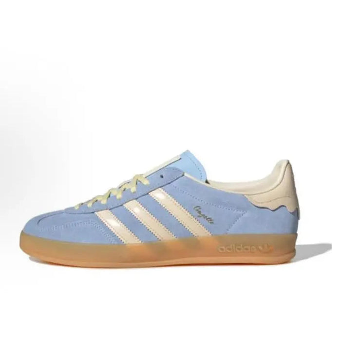 Gazelle Indoor sneaker in light blue with beige stripes and tan gum sole