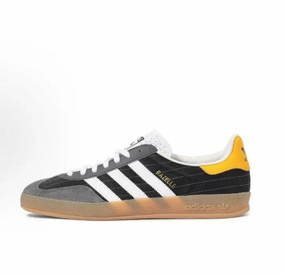 Adidas Gazelle indoor sneakers, black suede, white stripes, yellow heel, gum sole