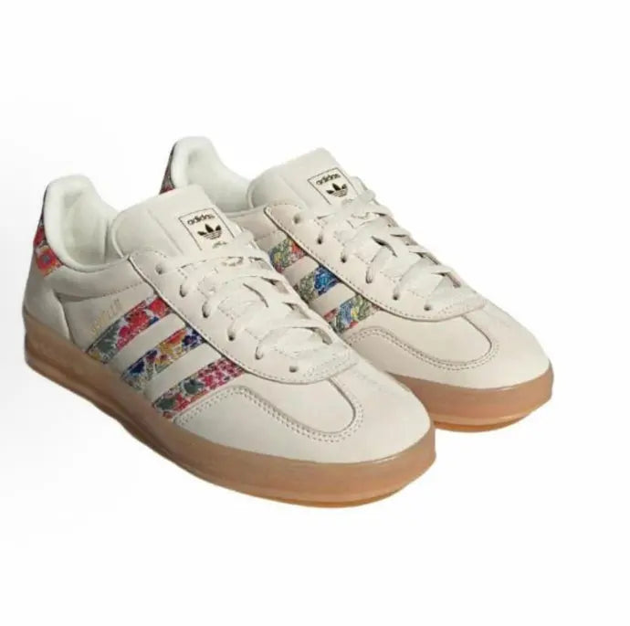 Adidas Gazelle Indoor sneakers with cream uppers, multicolor stripes, and gum sole