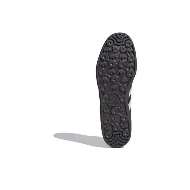Low-top sneaker outsole with circular traction tread, dark rubber