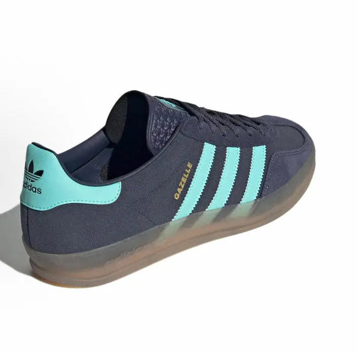 Adidas Gazelle Indoor low-top sneaker, dark navy with turquoise heel tab and 3-Stripes, gum sole.