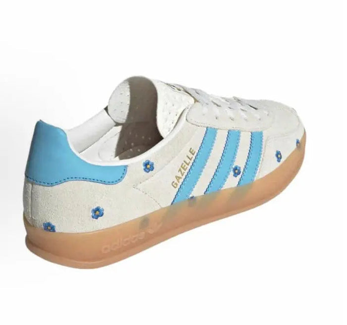 Adidas Gazelle Indoor sneakers, beige upper with blue heel tab, floral details, gum sole