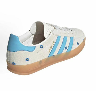 Adidas Gazelle Indoor sneakers, beige upper with blue heel tab, floral details, gum sole