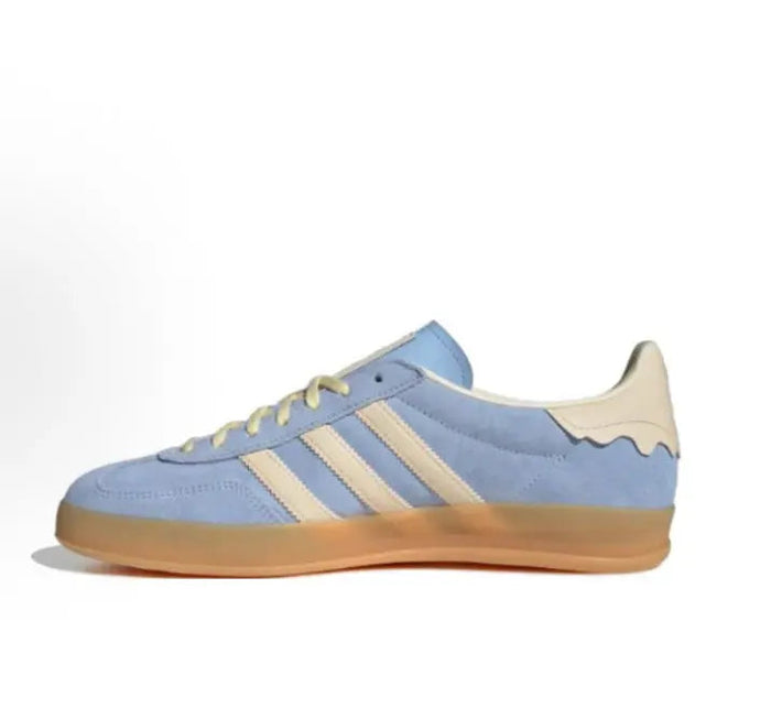 Gazelle Indoor sneaker side view, light blue upper with beige lining and gum sole
