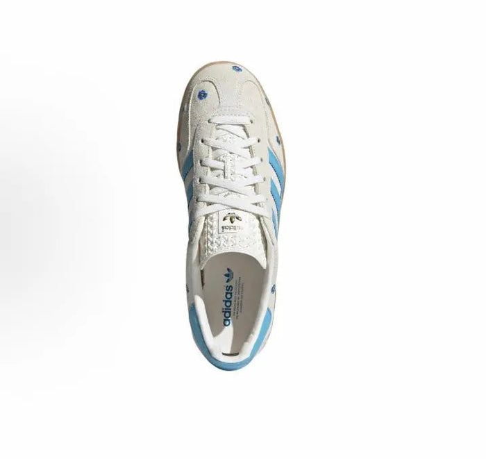 Adidas Gazelle Indoor sneakers, top view with blue stripe panel and white lace-up