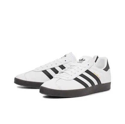 Adidas Gazelle Indoor sneakers, white leather with black stripes and lace-up front