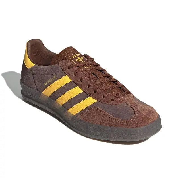Adidas Gazelle Indoor lace-up sneakers in brown with yellow stripes on sides