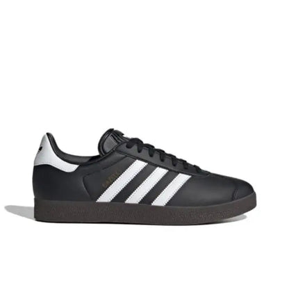 Gazelle indoor sneakers side profile, black leather with white stripes and rubber sole