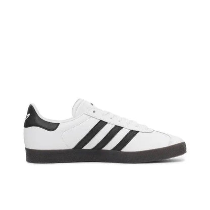 Gazelle Indoor sneakers, side view in white with black stripes and dark rubber sole