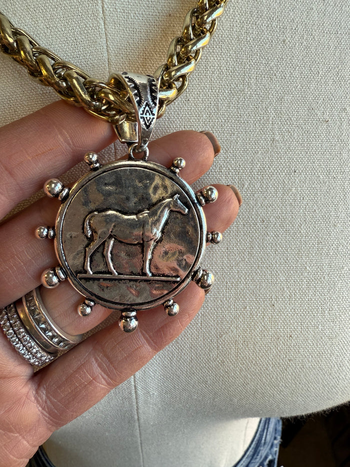 Horse coin medallion pendant necklace with round antiqued charm and bead-like ring accents