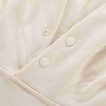 Beige fabric detail with snap buttons on the hood opening placket.