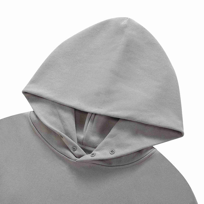 Grey hoodie with hood and button placket at neckline.