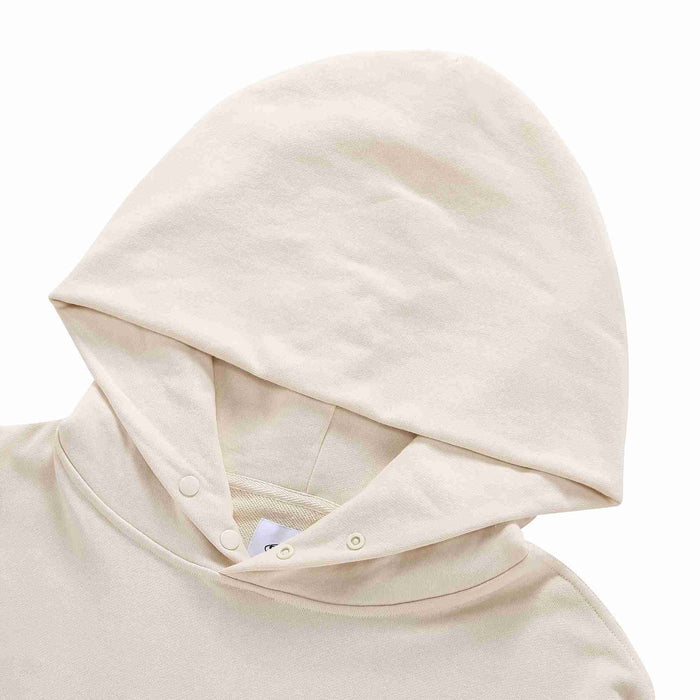 Beige pullover hoodie with hood and buttoned neckline placket detail.