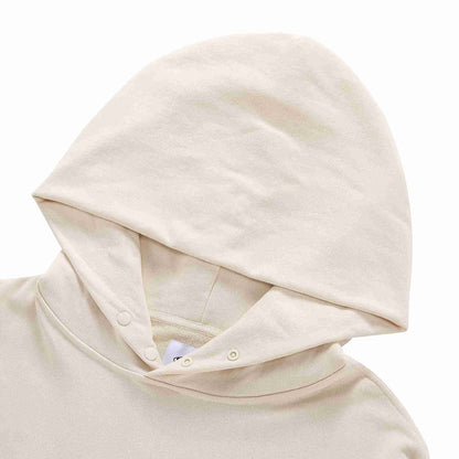 Beige pullover hoodie with hood and buttoned neckline placket detail.