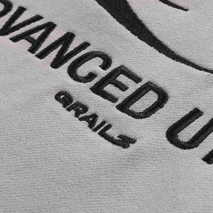 Gray hoodie chest text 'ADVANCED UTILITY' and logo mark