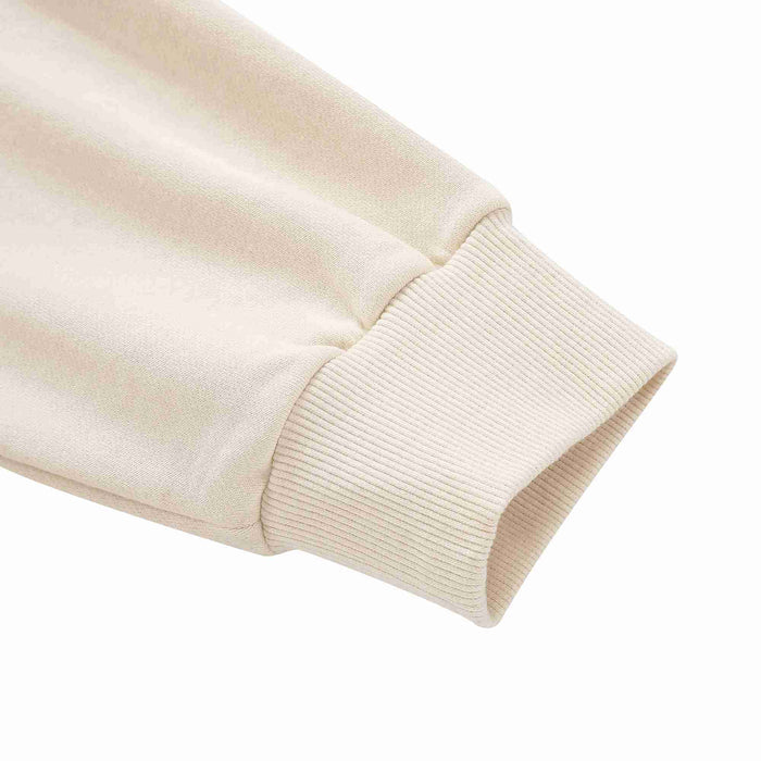 Beige hoodie ribbed knit sleeve cuff detail with elastic hem edge.