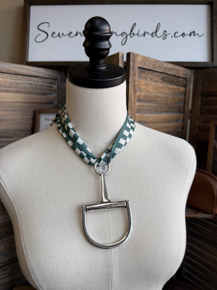 Green and white checked twilly scarf on mannequin with tie ends and metal clasp