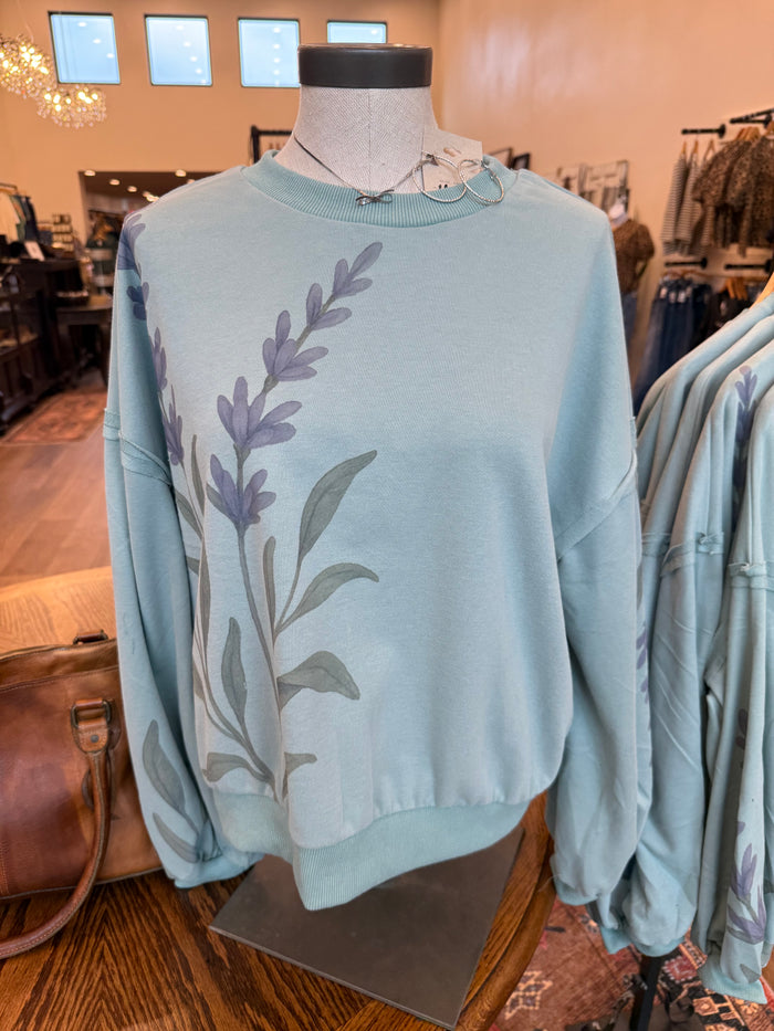 Floral watercolor sweatshirt in light blue with large back floral sprig print and crew neck