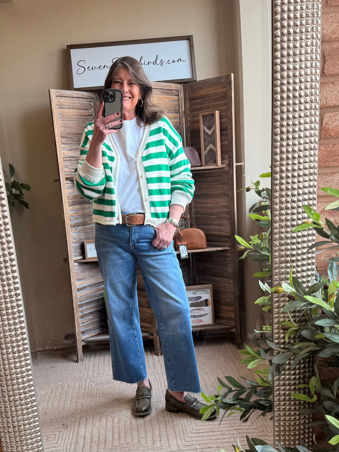 Green and white striped cardigan, button placket and ribbed cuffs, partial front