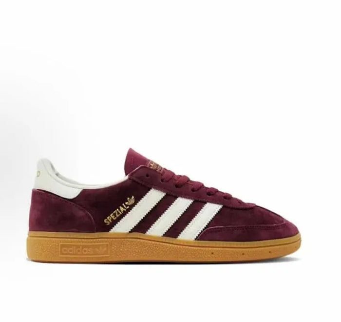 Adidas Handball Spezial low-top sneakers in burgundy suede with white stripes and gum sole