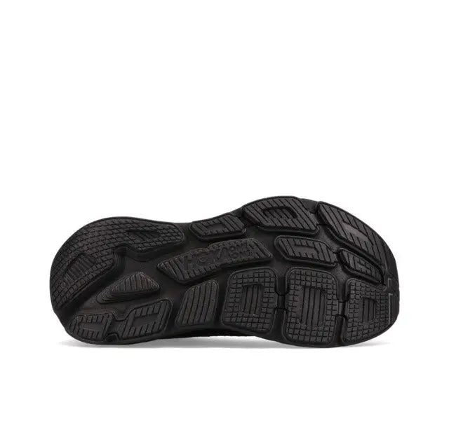 Black running shoe outsole with traction lugs and molded tread pattern