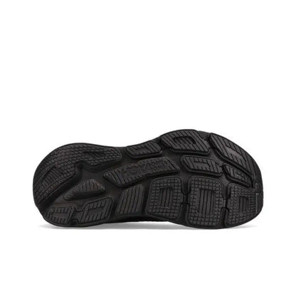 Black running shoe outsole with traction lugs and molded tread pattern