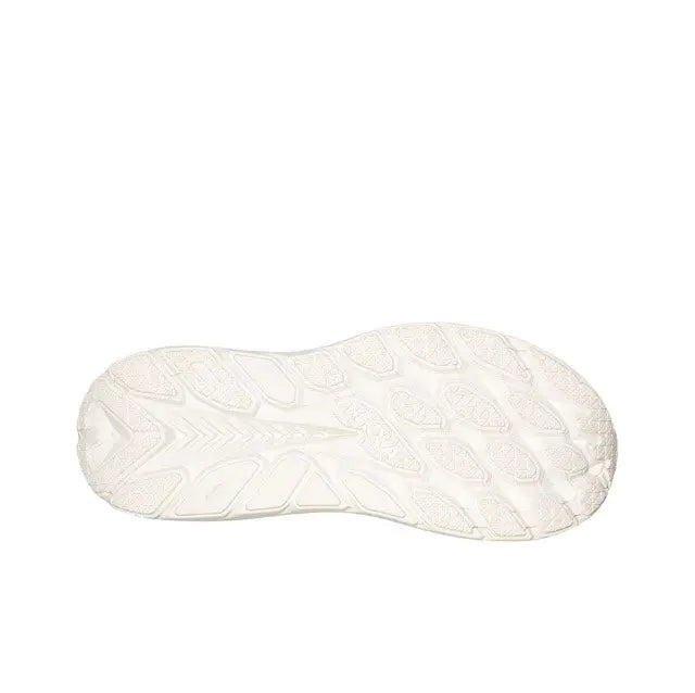 White running shoe outsole with textured tread and cushioned midsole