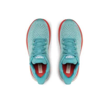 Teal running shoes with red-edged collars and white laces, top view