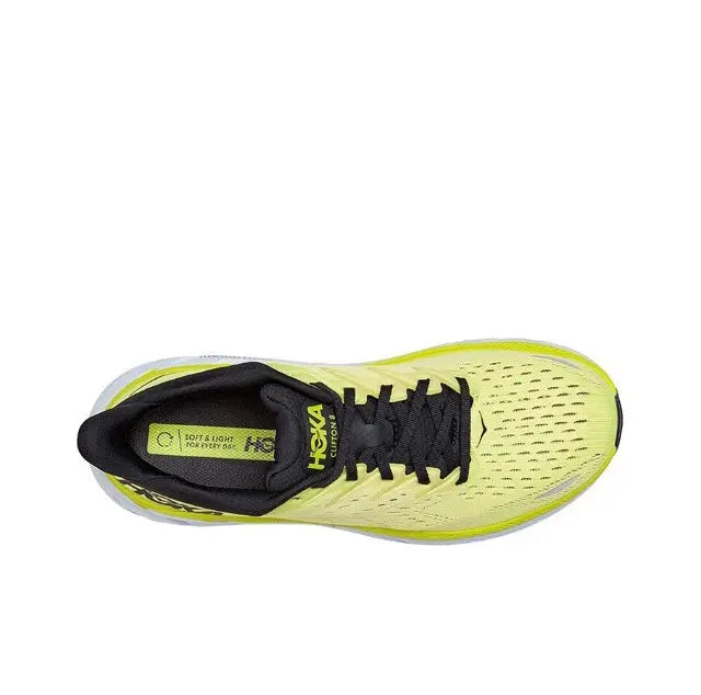 Lime yellow running shoe with black tongue, black laces, and textured upper