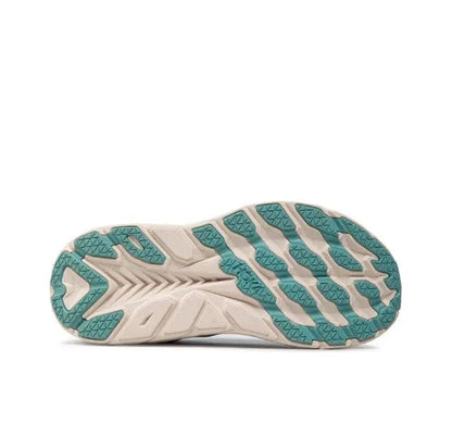 Teal and white outsole with traction tread pattern