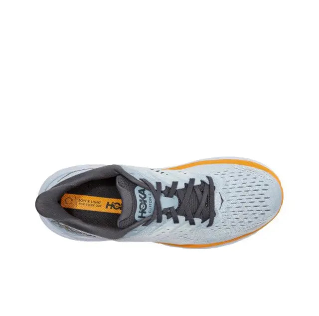 Light blue running shoe with black laces, gray tongue, orange heel accent