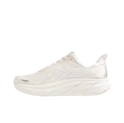 White low-top running shoe with textured knit upper and thick foam sole